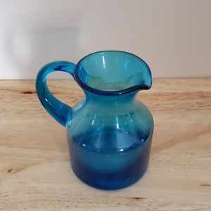 Small blue glass pitcher